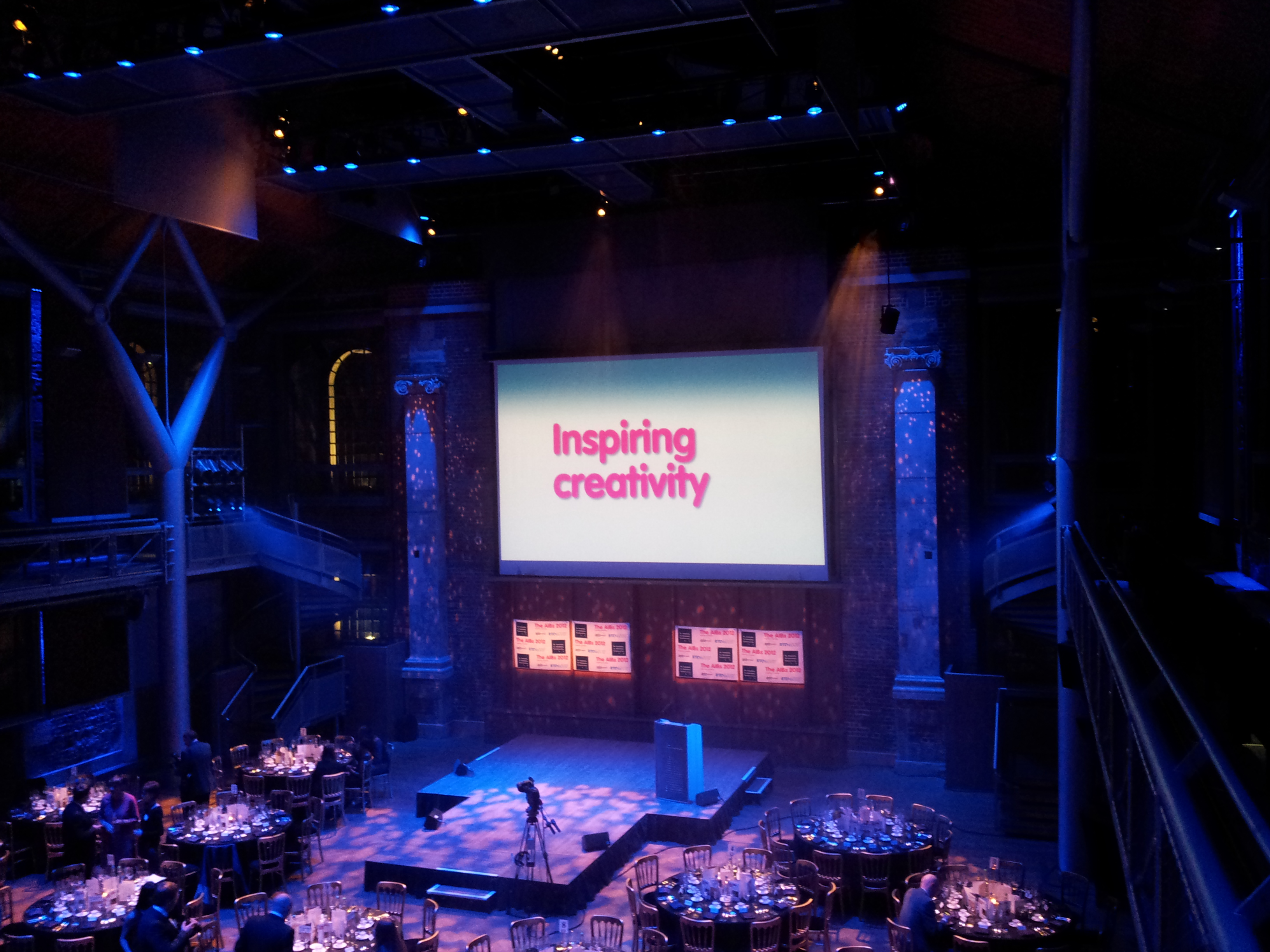 Photo of the 2012 AIBs dinner set up with "Inspiring Creativity" on the main screen